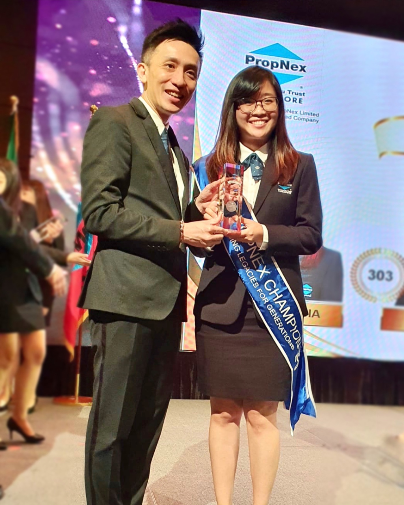 Celine receiving an award at a professional recognition ceremony