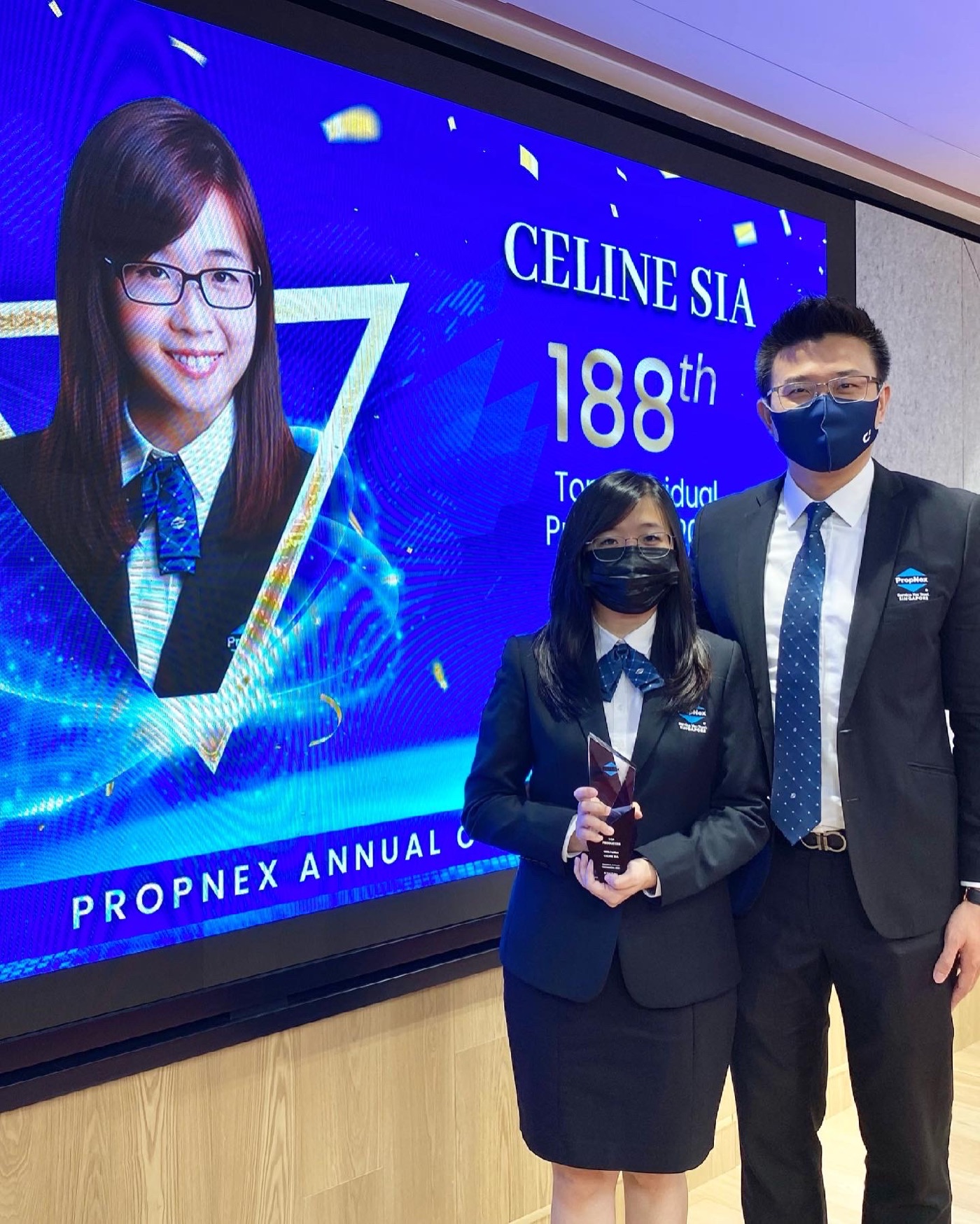 Celine and Stevenson with a professional achievement award