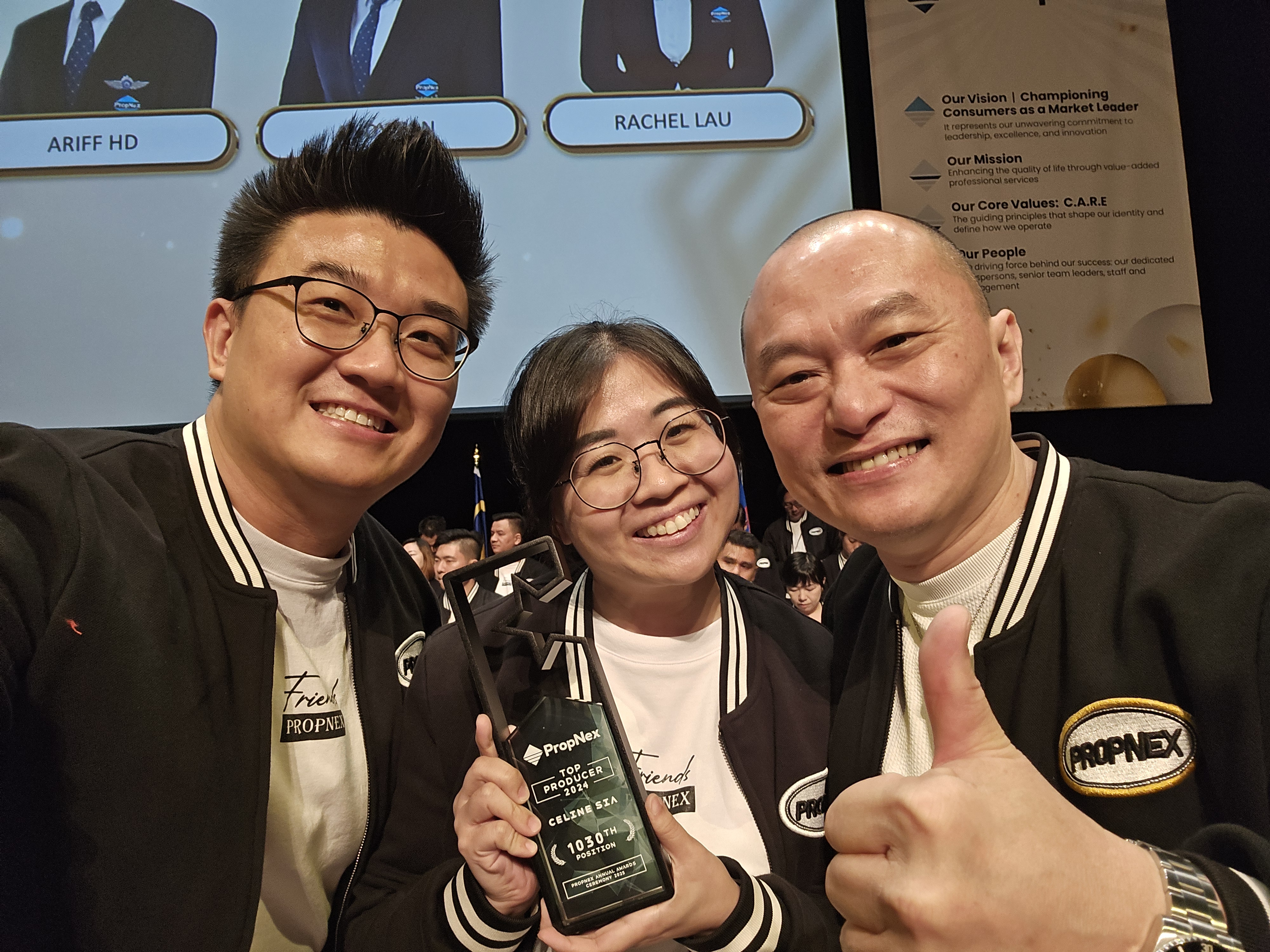 Celine and Stevenson celebrating a Top Producer award