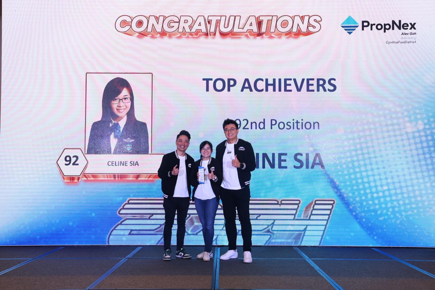 Celine and Stevenson celebrating a Top Achiever award